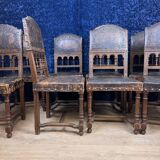Set of 8 Renaissance style chairs in walnut and embossed leather