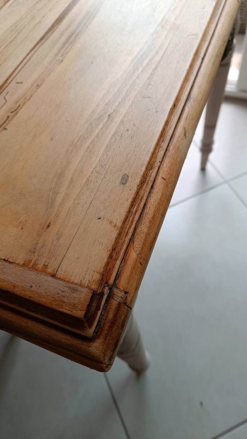 Antique wooden desk with a patinated base
