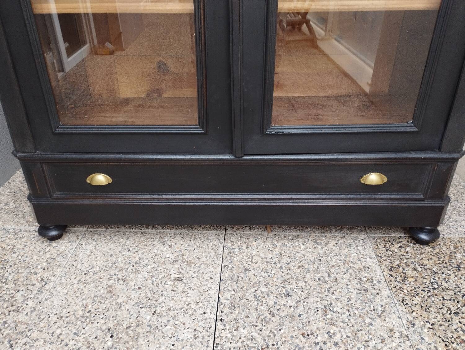 Bookcase black patina shell pediment 2 drawer doors
