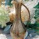 Carafe vase in chiseled brass