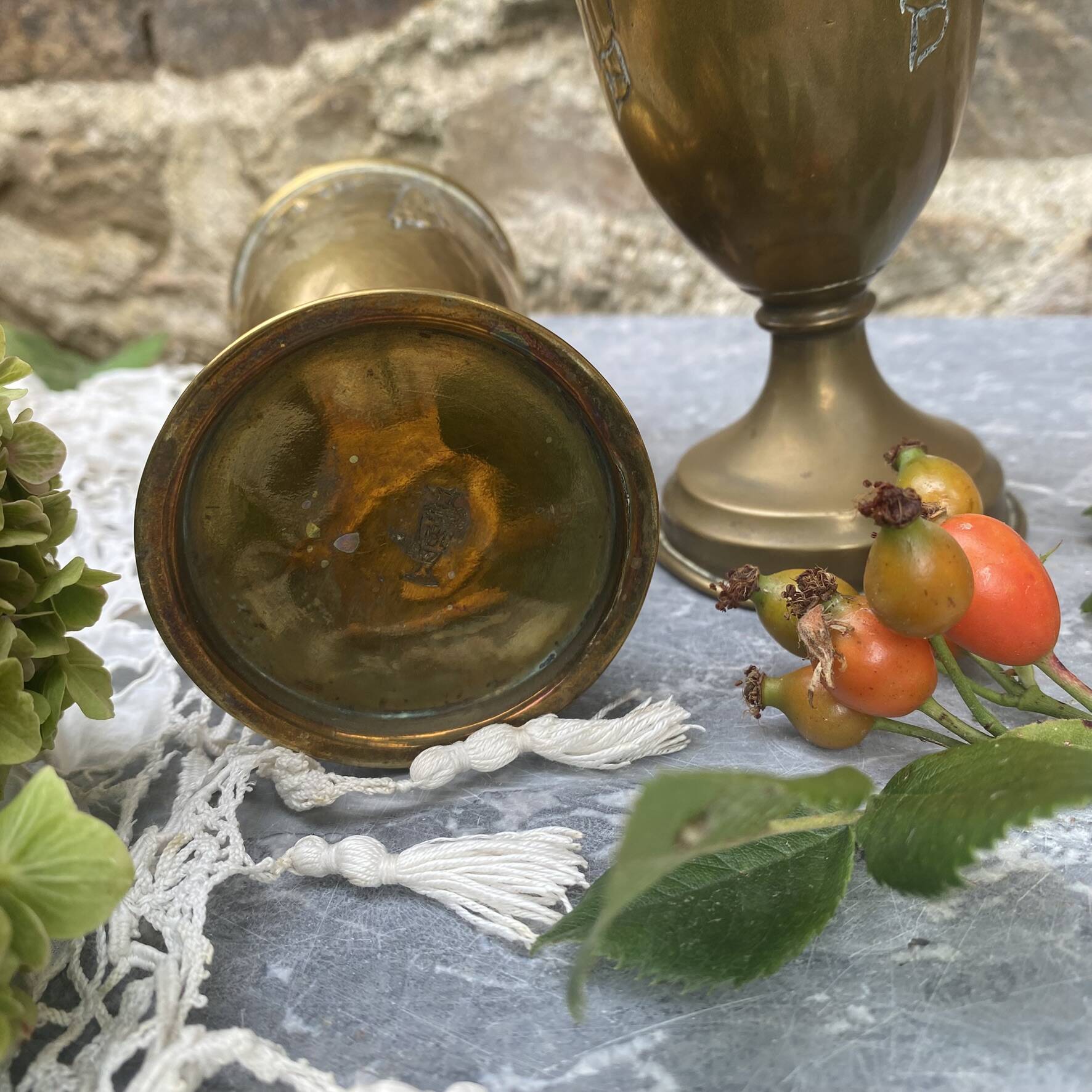 Pair of embossed brass bud vases stamped 17 cm
