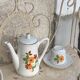 Porcelain dinette for dolls consisting of a coffee maker, cups and saucers, vintage