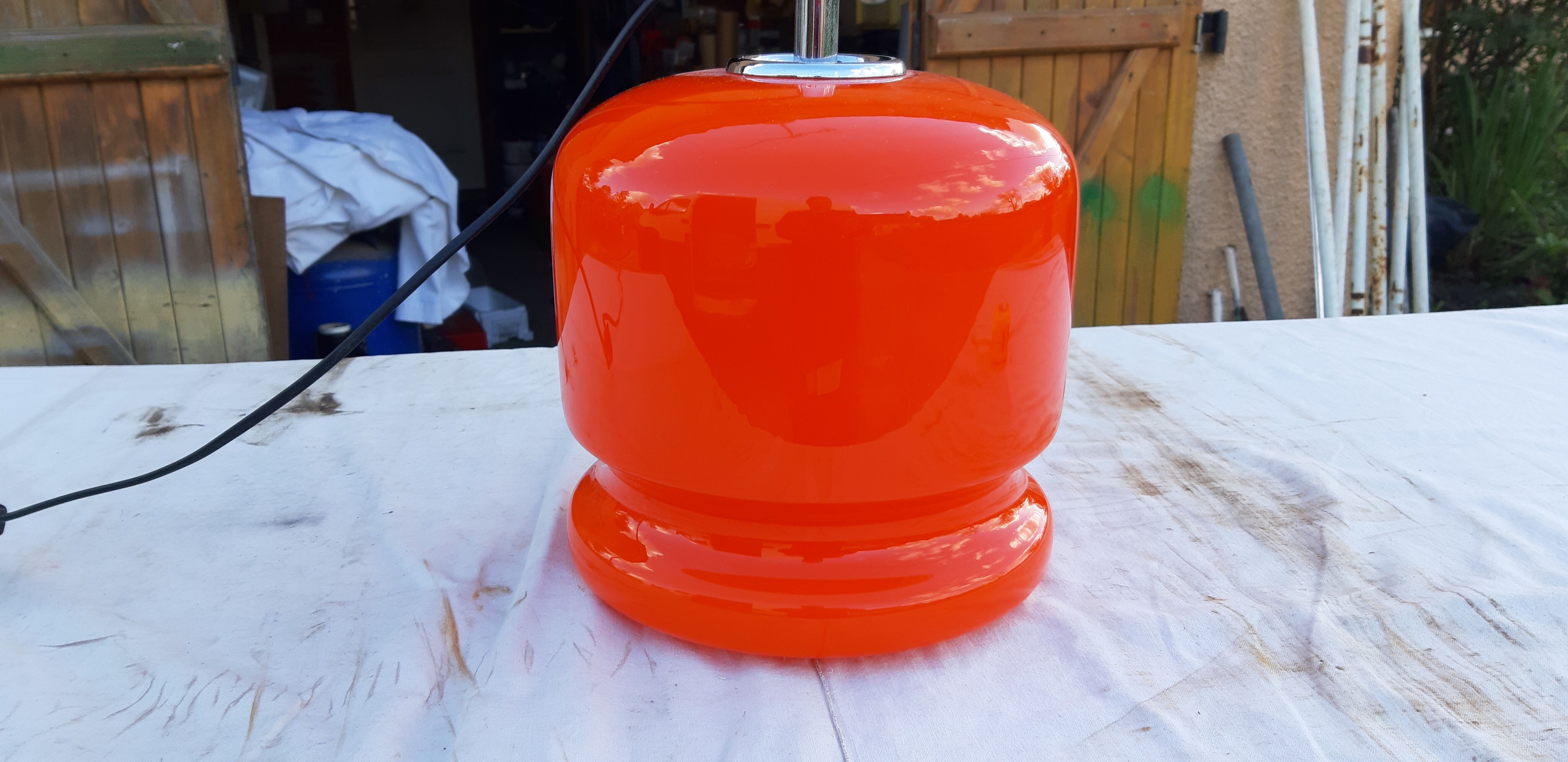 Vintage lamp of the 70s in orange opaline