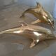 Brass dolphins
