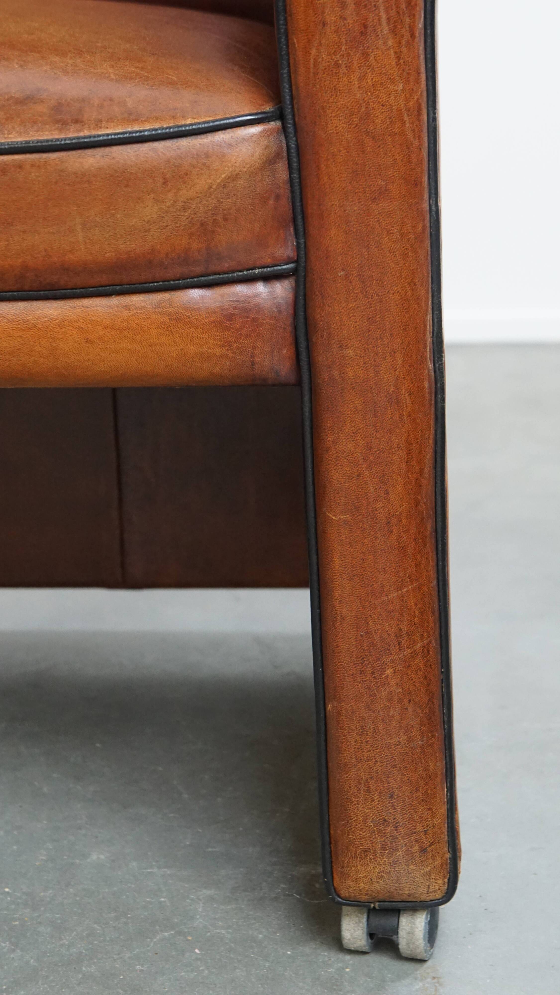 Vintage set of 4 sheepskin leather dining chairs on castors