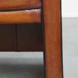 Vintage set of 4 sheepskin leather dining chairs on castors