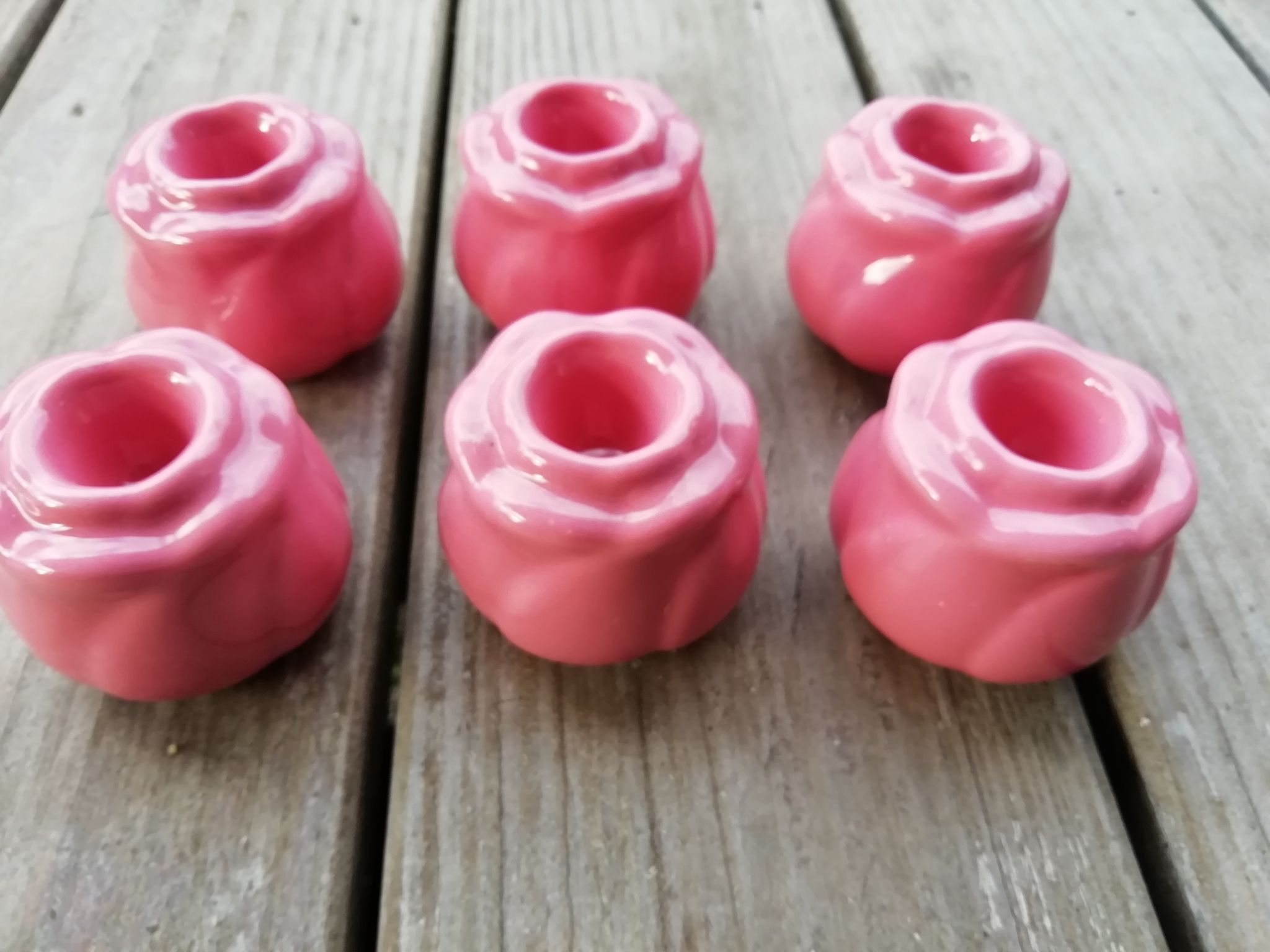 Set of candle holders shaped rosebud