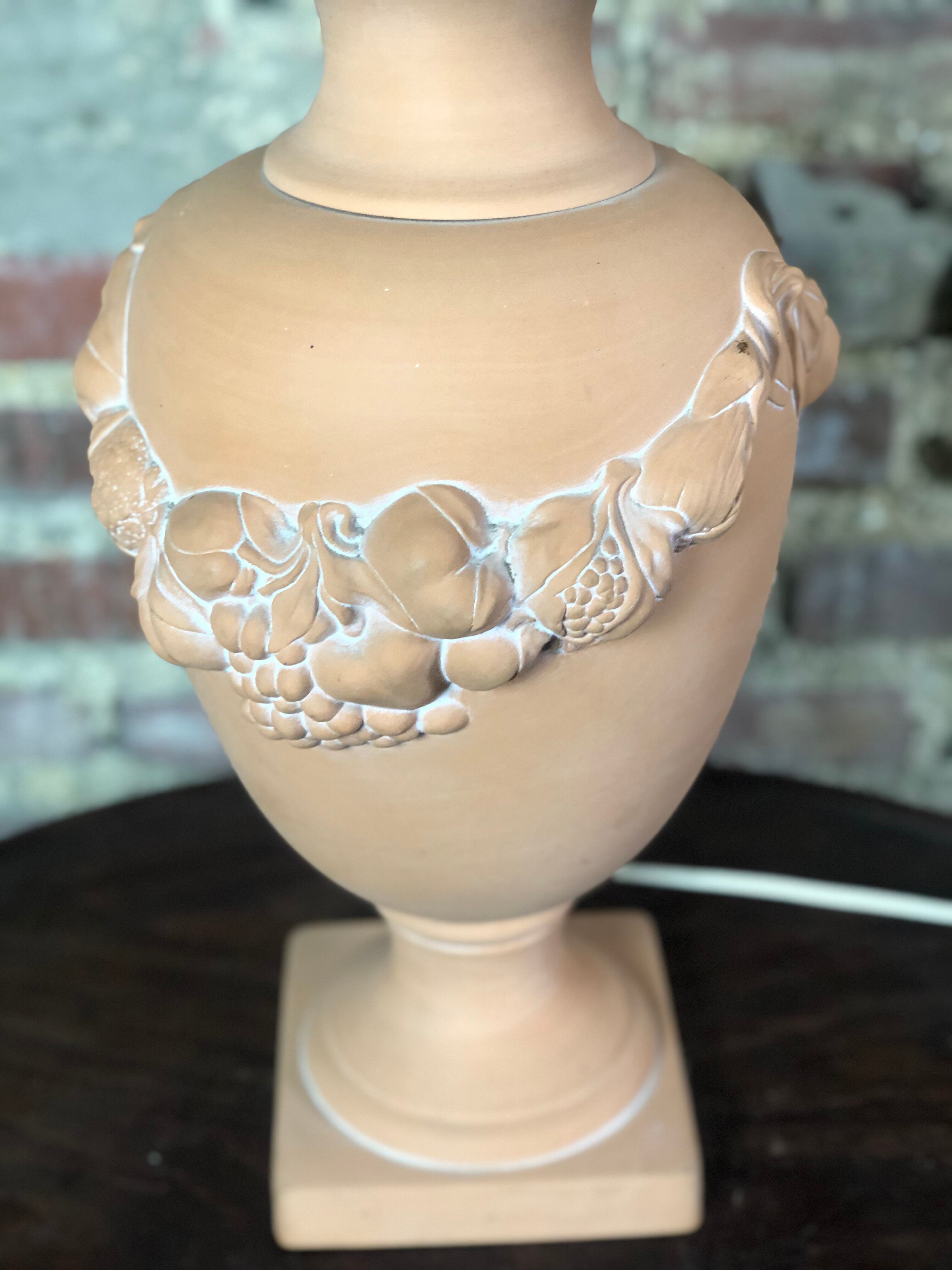Terracotta lamp decorated with fruit crown