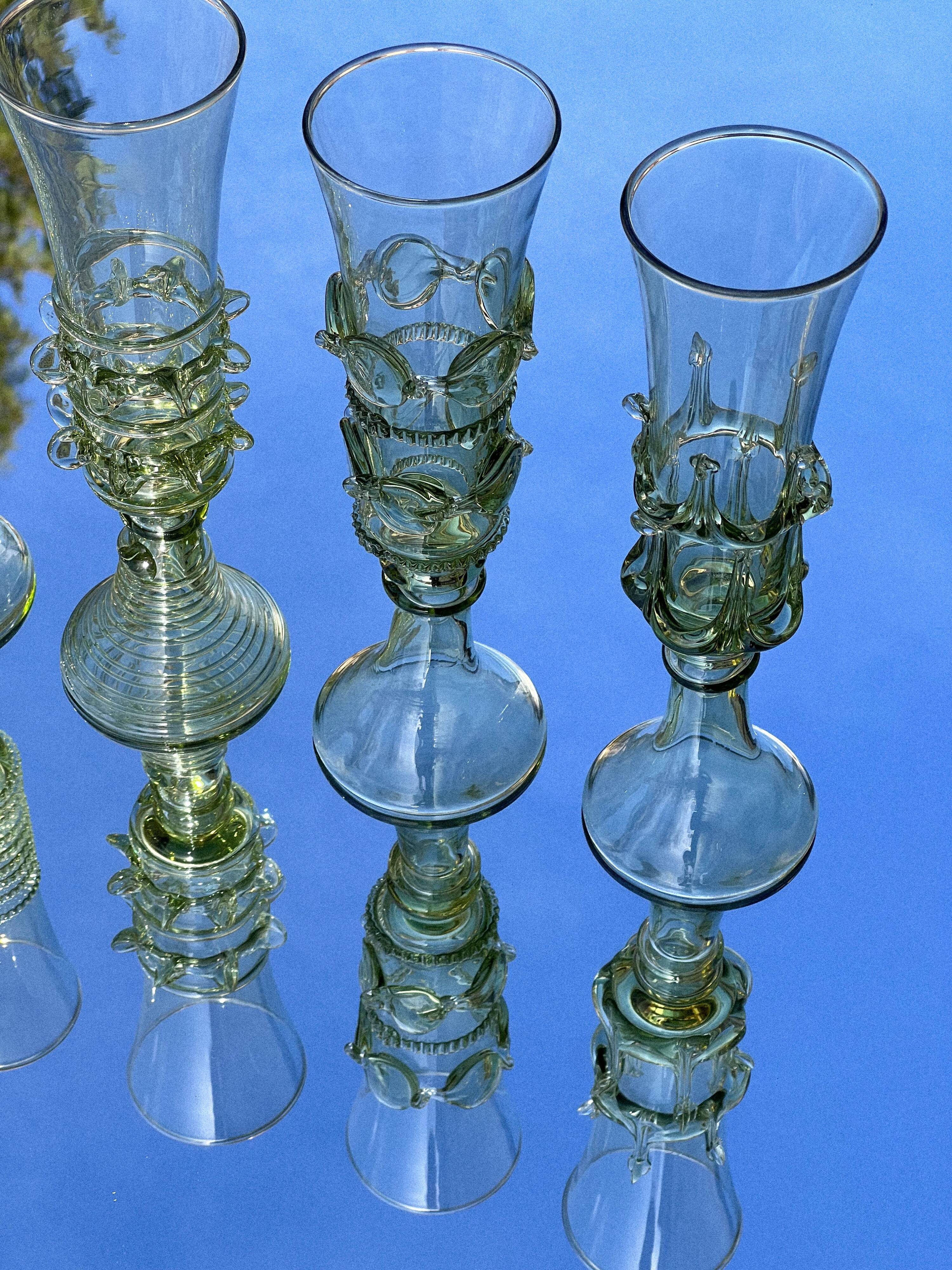 pair of green glass champagne flutes - label