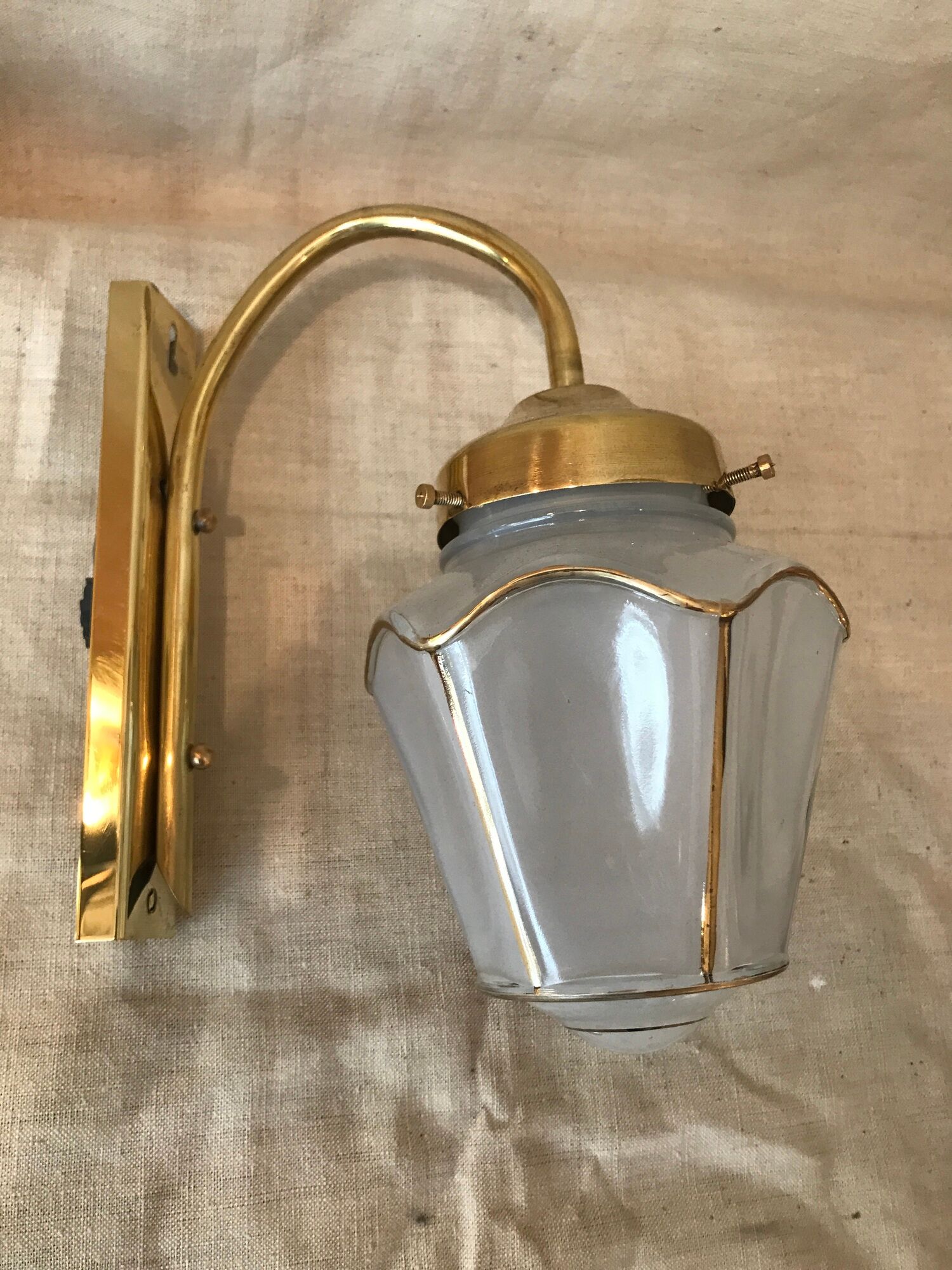Pair of 1960 brass wall lamps and gilded frosted glass