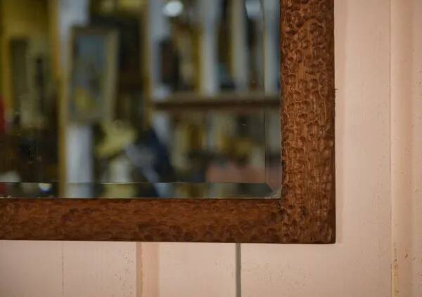 Brutalist mirror in gouged oak and beveled glass, 1960s