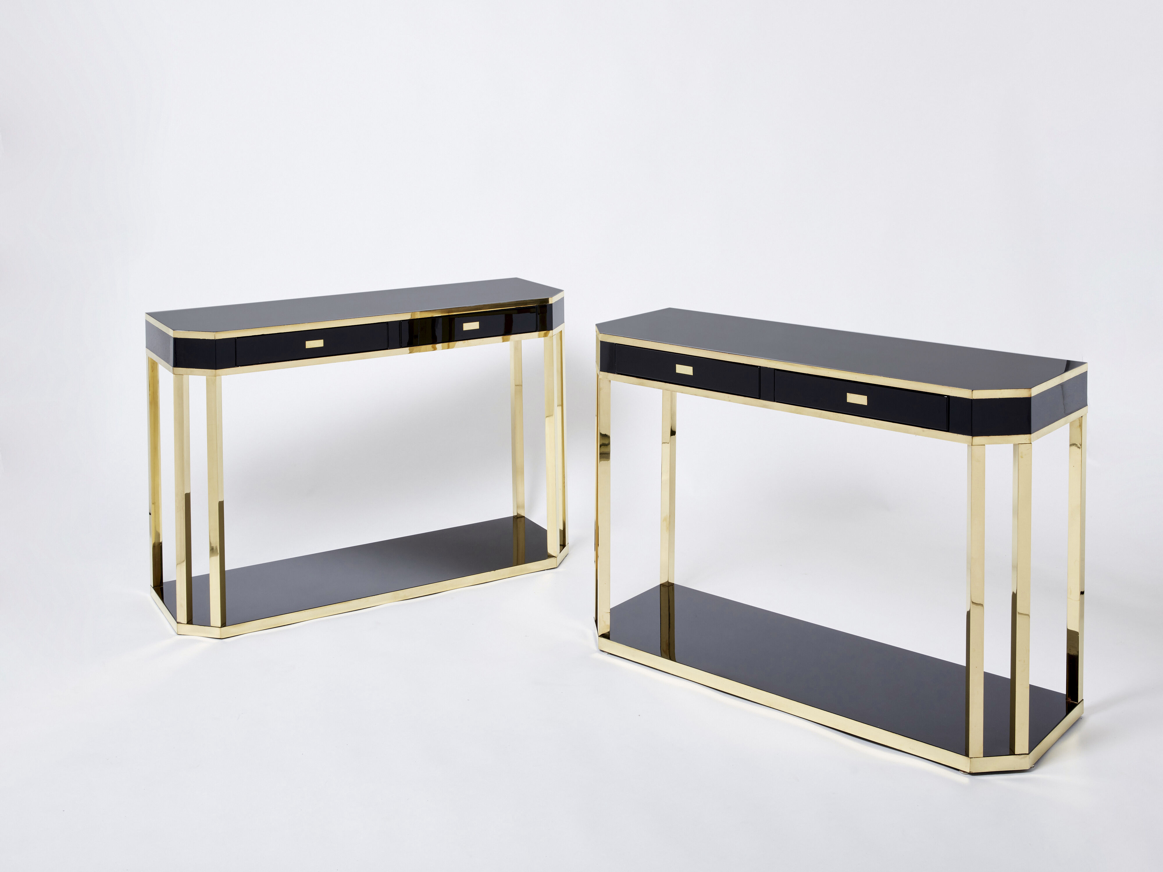Pair of black lacquered consoles and brass 1970