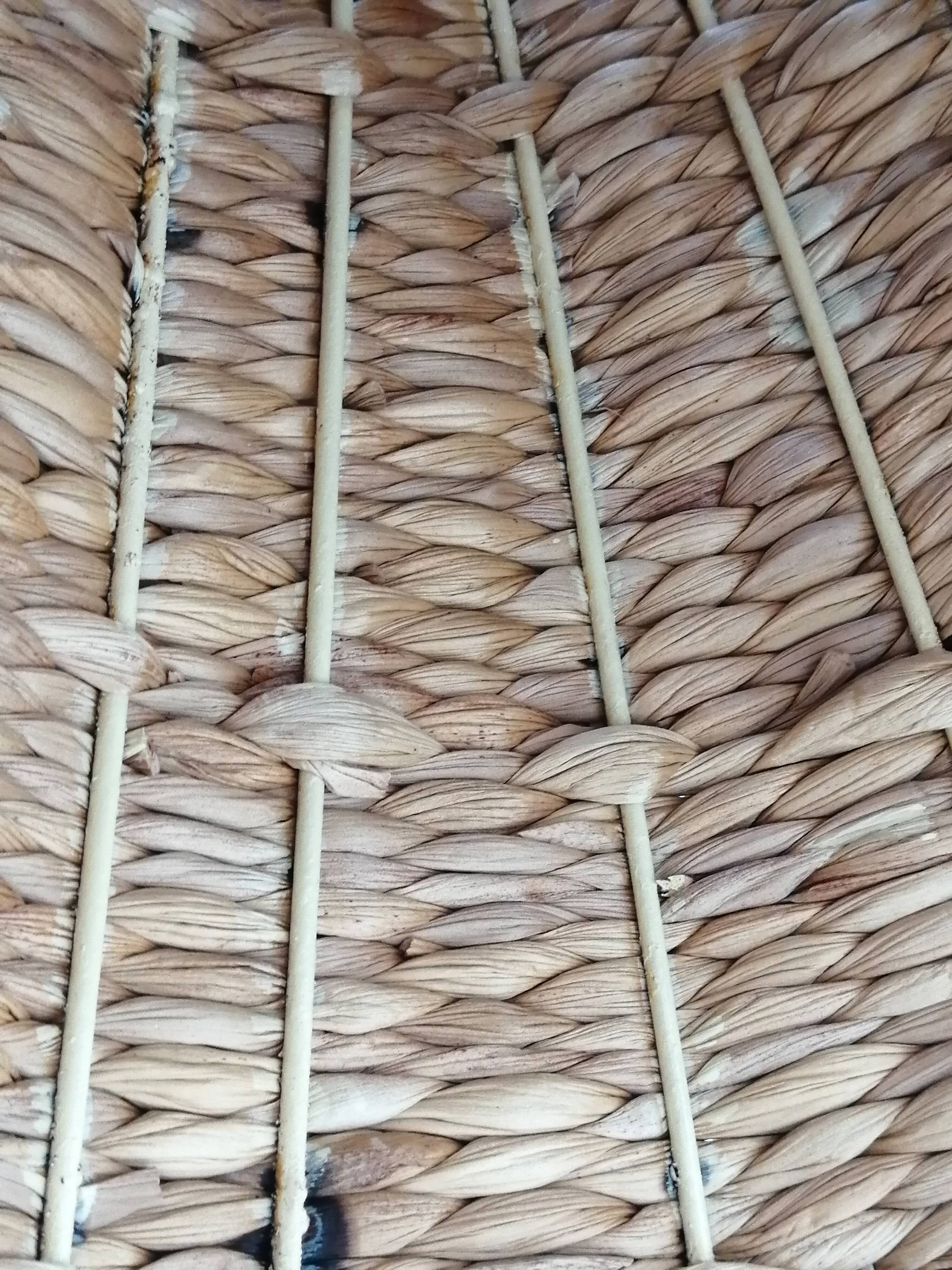 Model on a wicker stand.