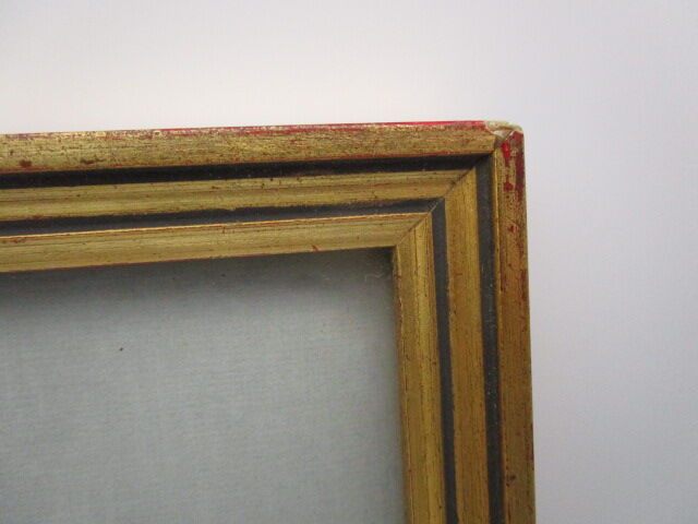 Old wooden and gilded stucco frame