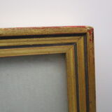 Old wooden and gilded stucco frame