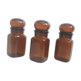 Trio round brown apothecary bottles