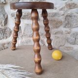 Wooden tripod stool with spool foot