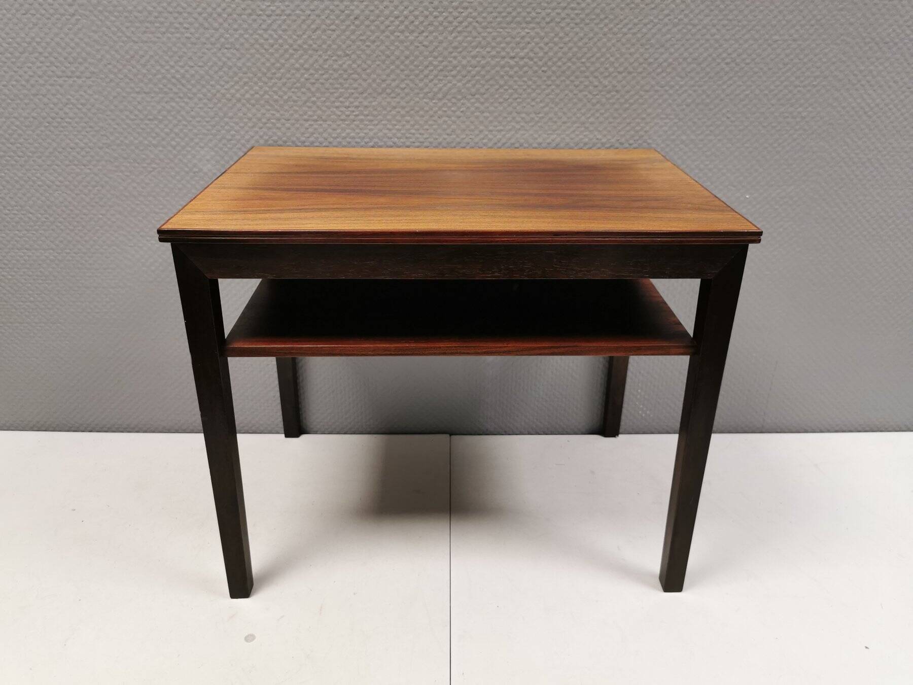 Nice side table in rosewood, probably Danish and from the 60s.