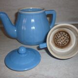 Individual coffee maker with bright blue filter