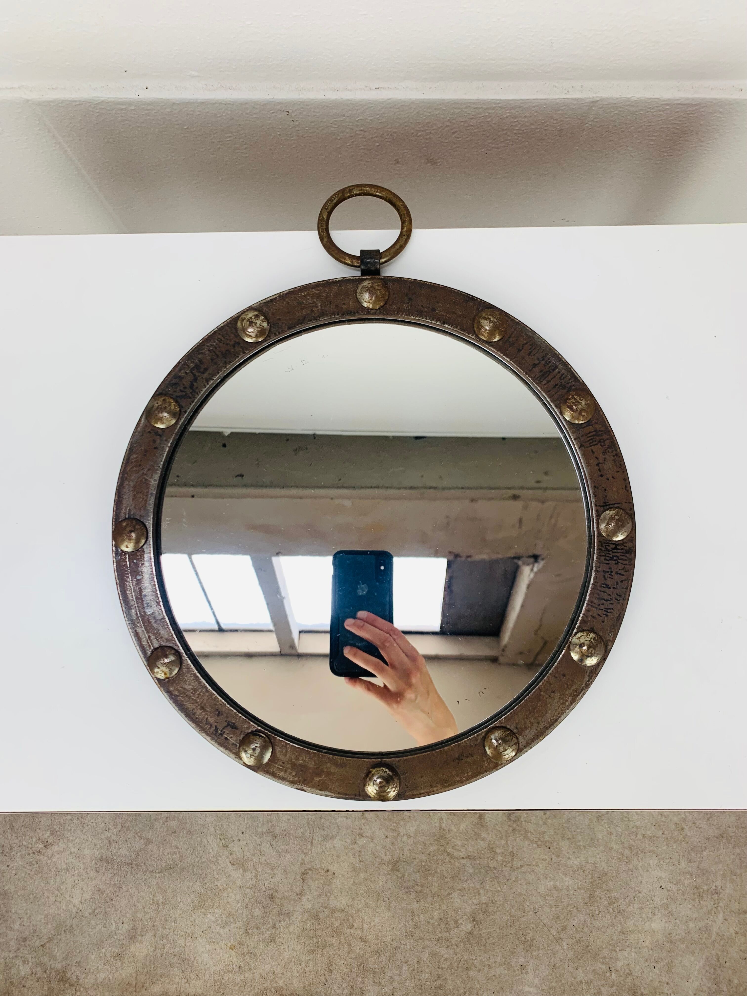 Round wrought iron porthole mirror