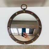 Round wrought iron porthole mirror