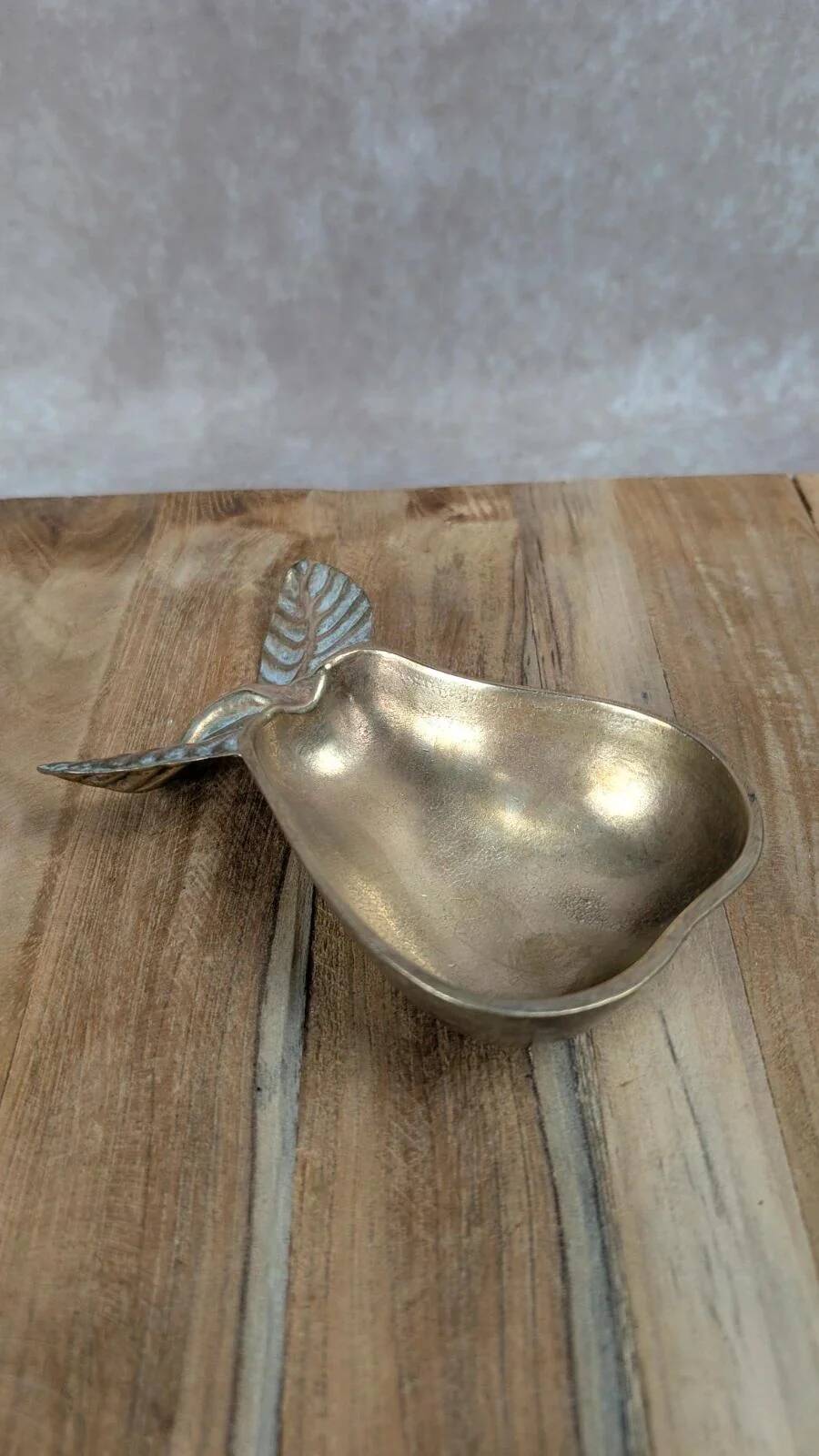 Small vintage brass trinket dish in the shape of a pear.