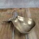 Small vintage brass trinket dish in the shape of a pear.