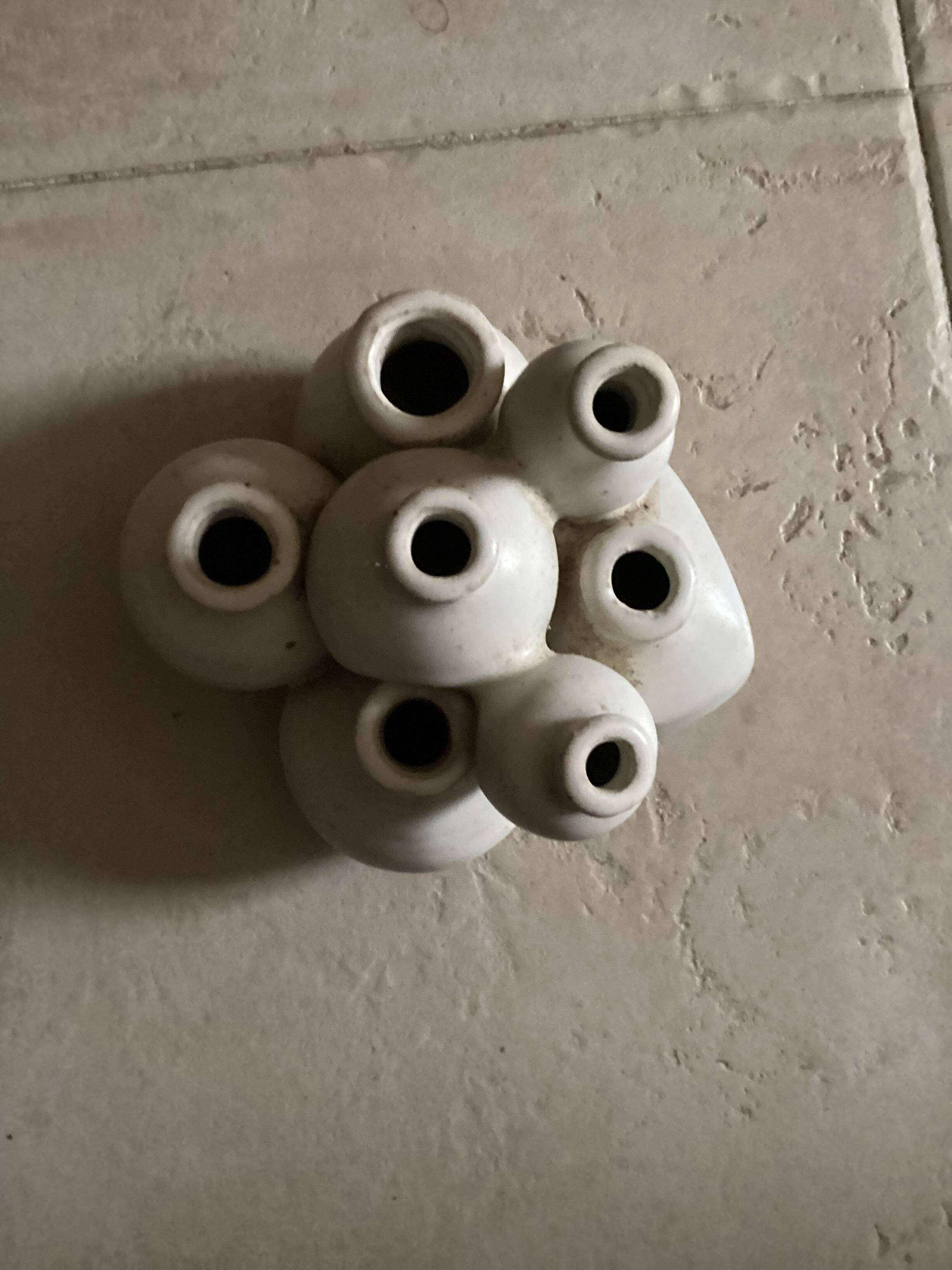 Beige ceramic flower pick