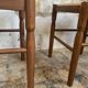 Pair of 20th century wooden stools with straw seats