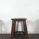 Tabouret d'atelier en bois peint brun à poignée