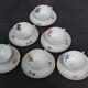 Set de 6 tasses et sous-tasses en porcelaine de Limonges NBD, enluminées à la main, motifs fleuris