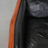 Black cowhide leather and wooden Art Deco design armchair