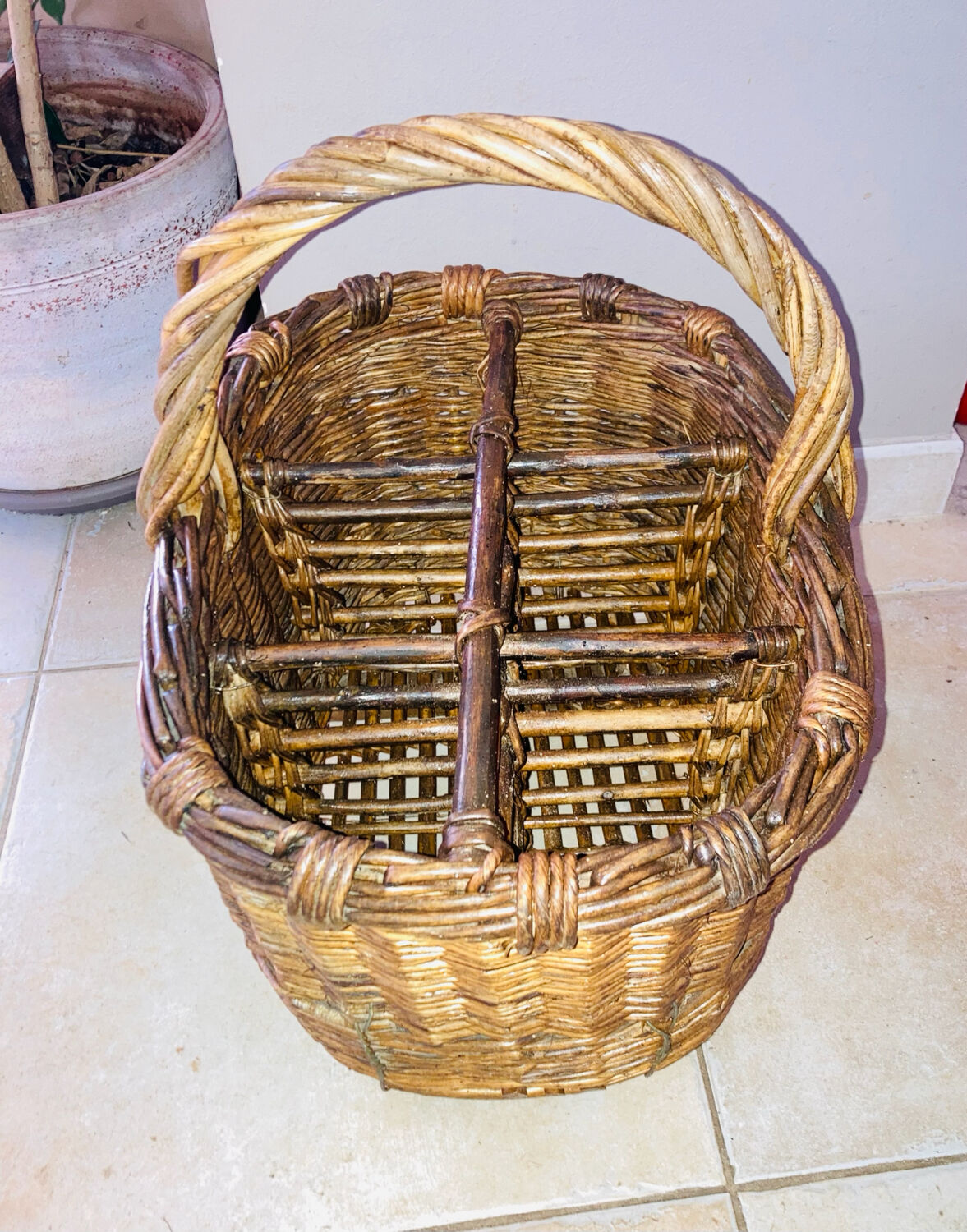 Wicker and hazel bottle basket from the early 20th century or possibly earlier.