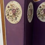 Four-panel screen decorated with an oval tapestry from the 20th century.