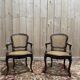 Paire de fauteuils de style Louis XV en cannage