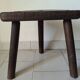 Antique tripod milking stool in solid wood – rustic & patina
