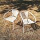 Pair of vintage white metal terrace armchairs