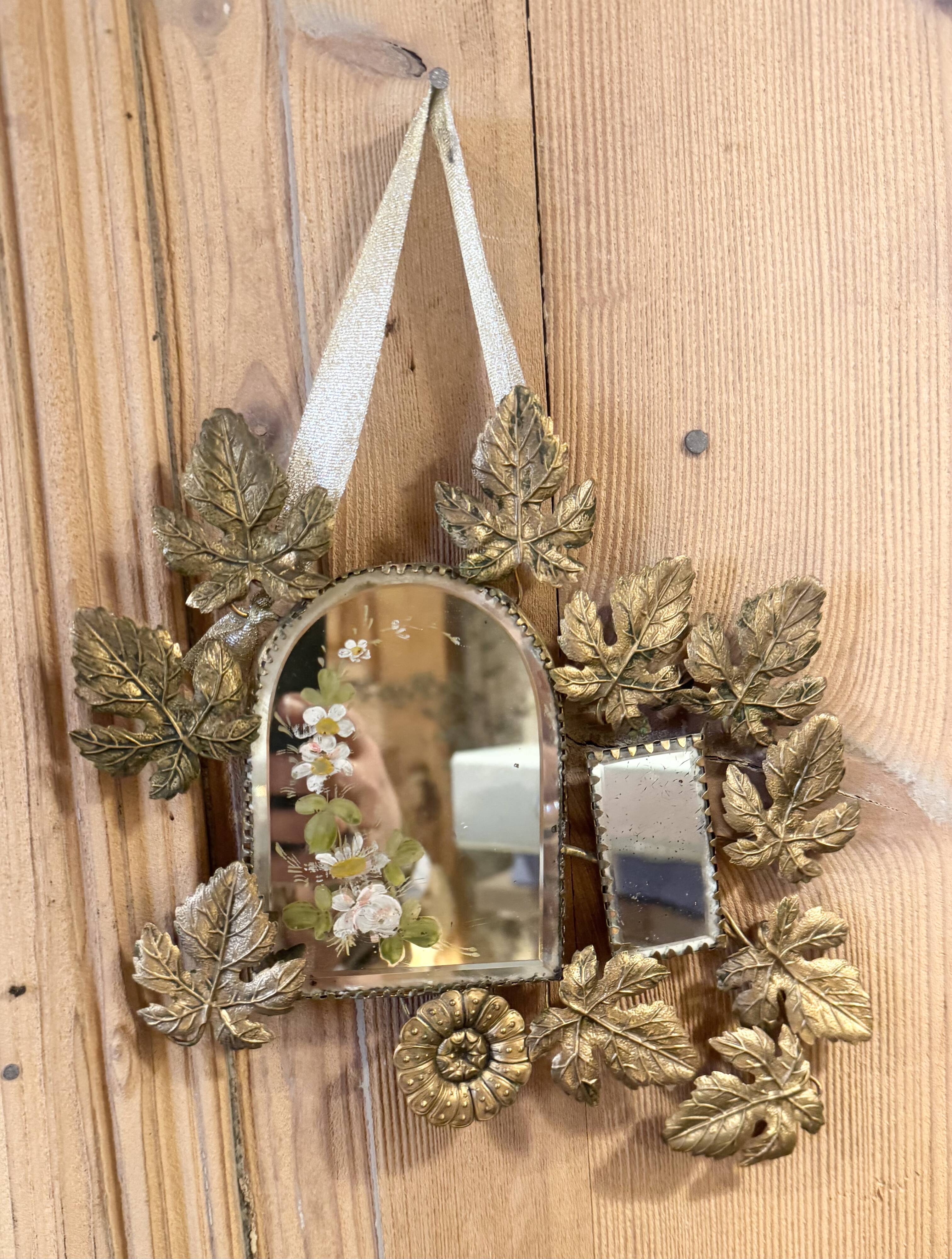 Ornamental brass mirror