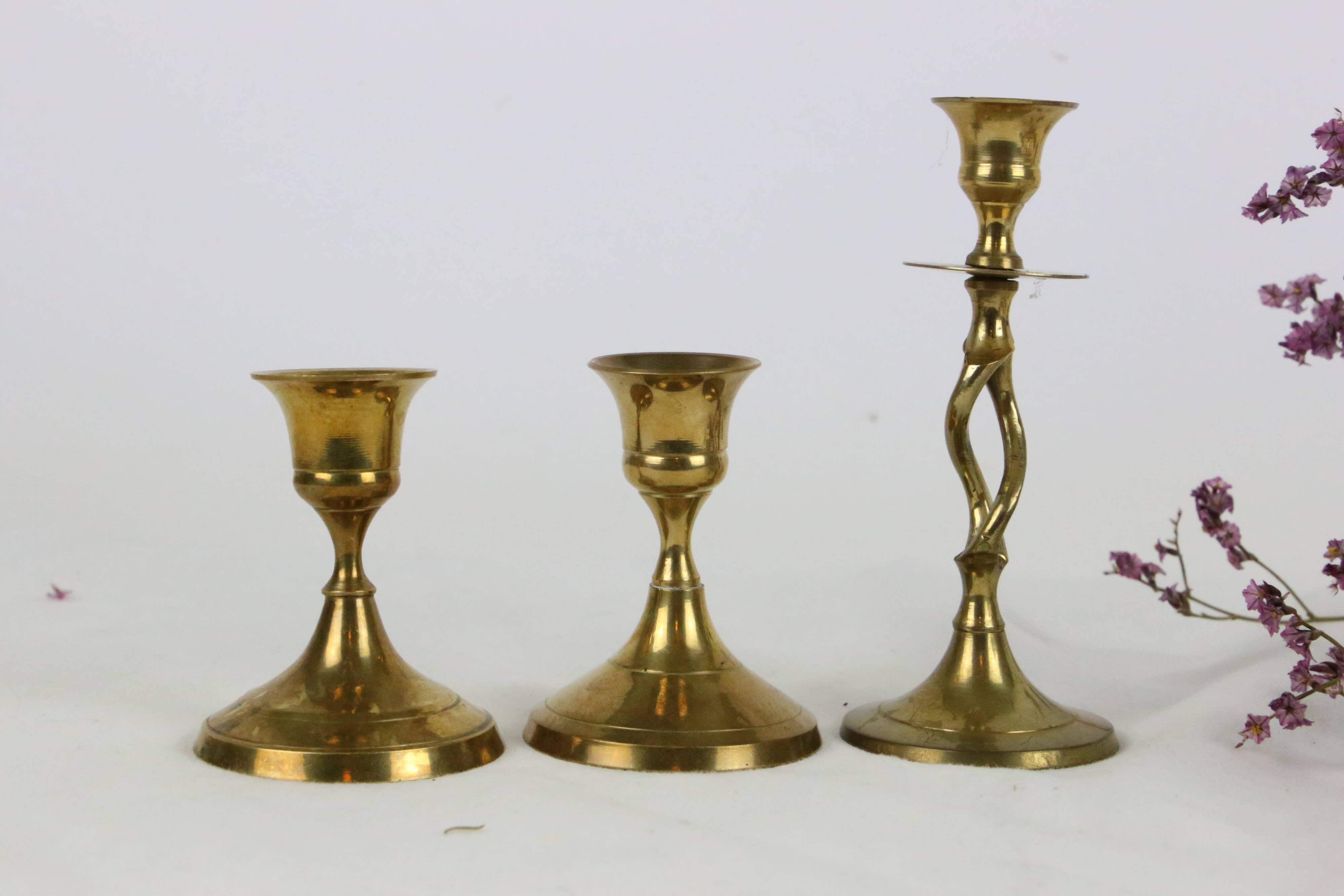 Trio of brass candle holders, vintage