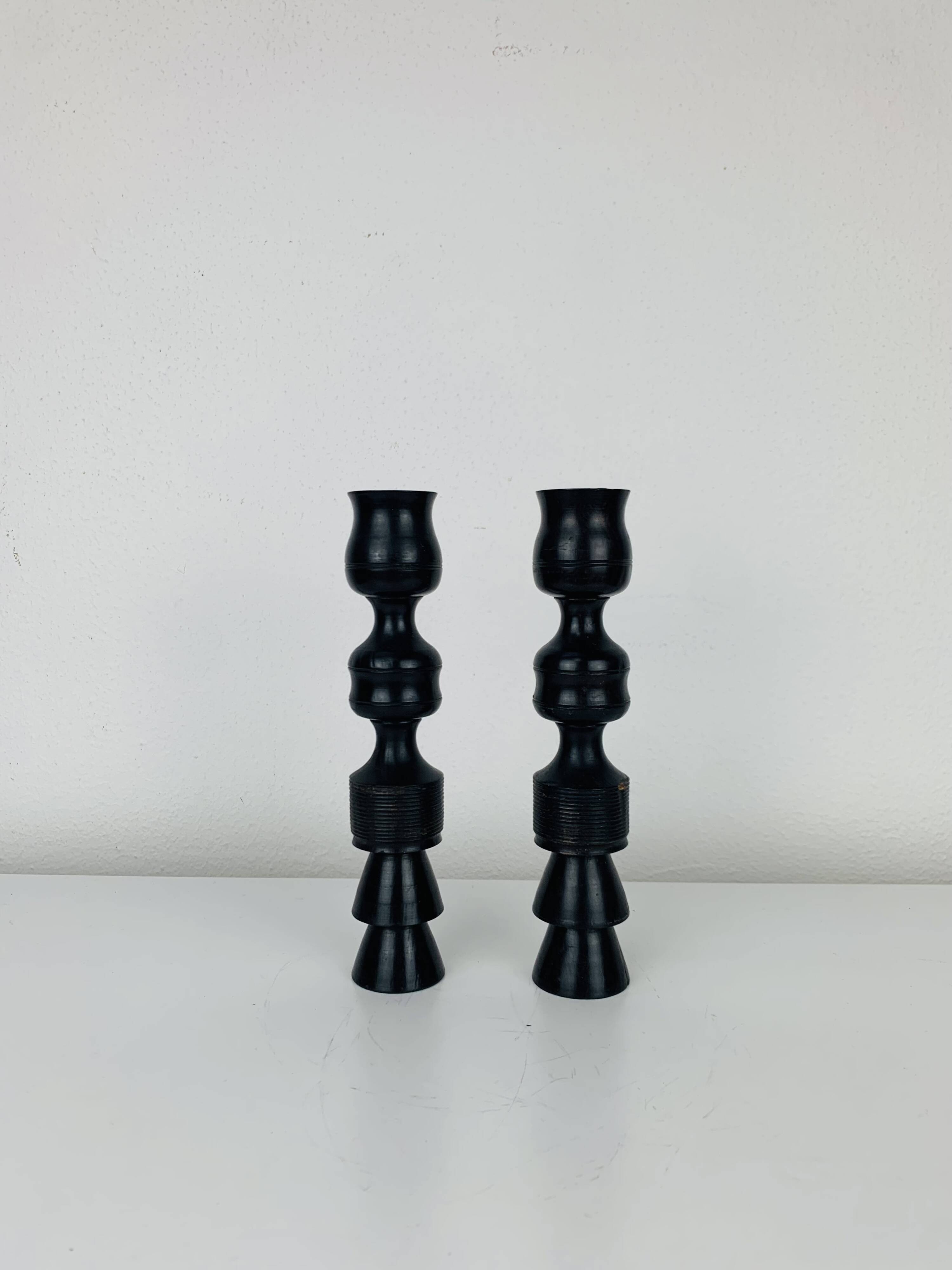 Pair of vintage ethnic blackened wood candlesticks