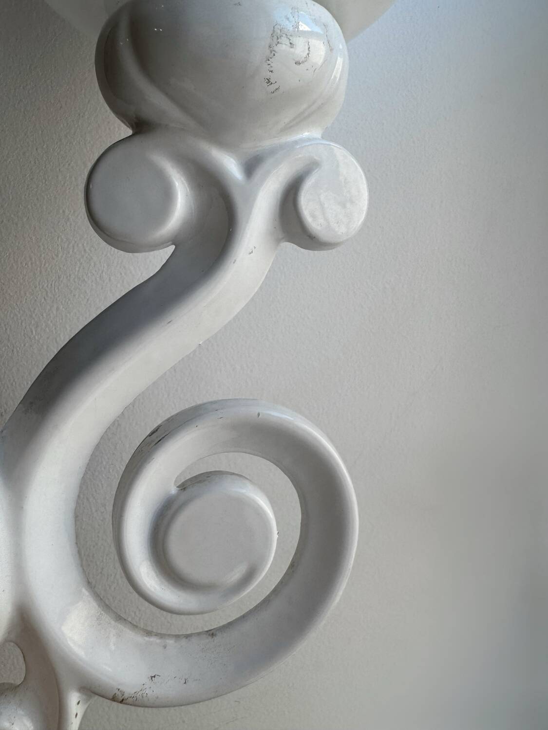 Cast iron and opaline wall lights from the 70s