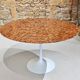 Round table in red marble by Eero Saarinen for Knoll