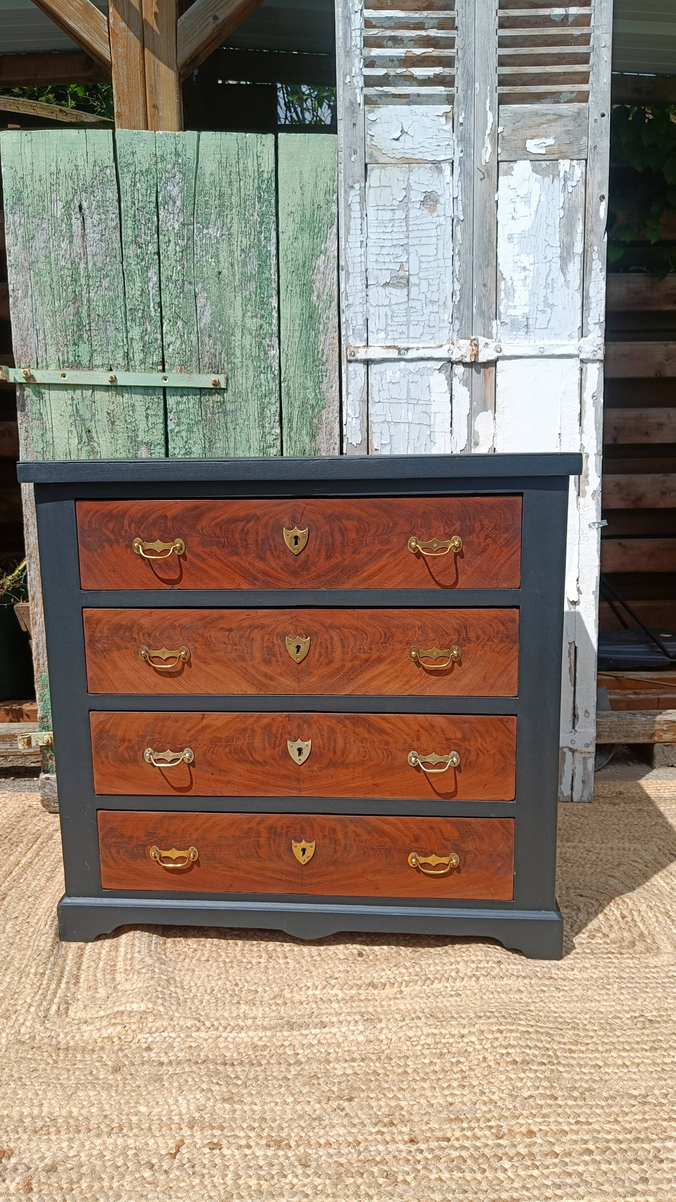 Vintage commode revamped in matte black & wood with warm tones.