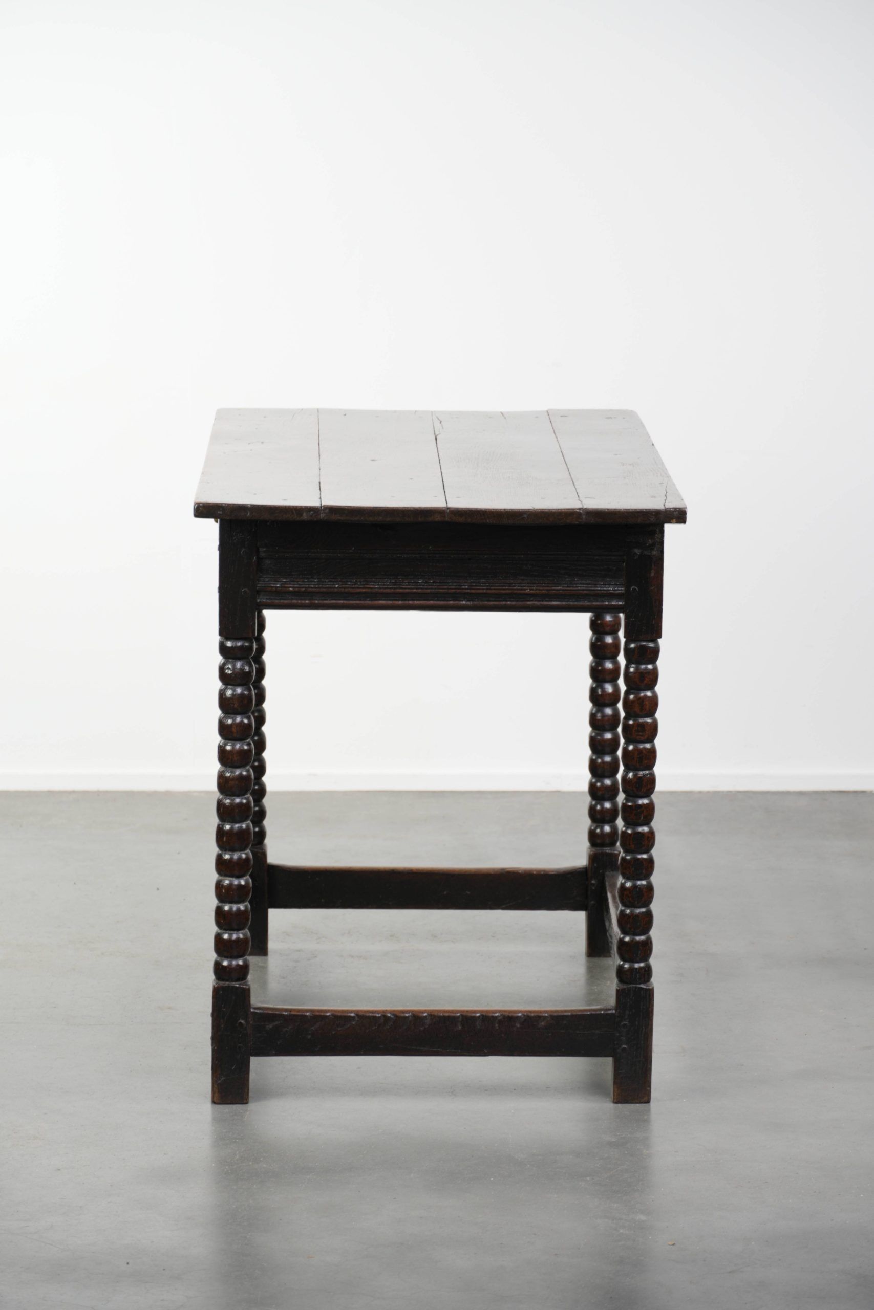 Antique English oak side table from the 18th century with bobbin legs