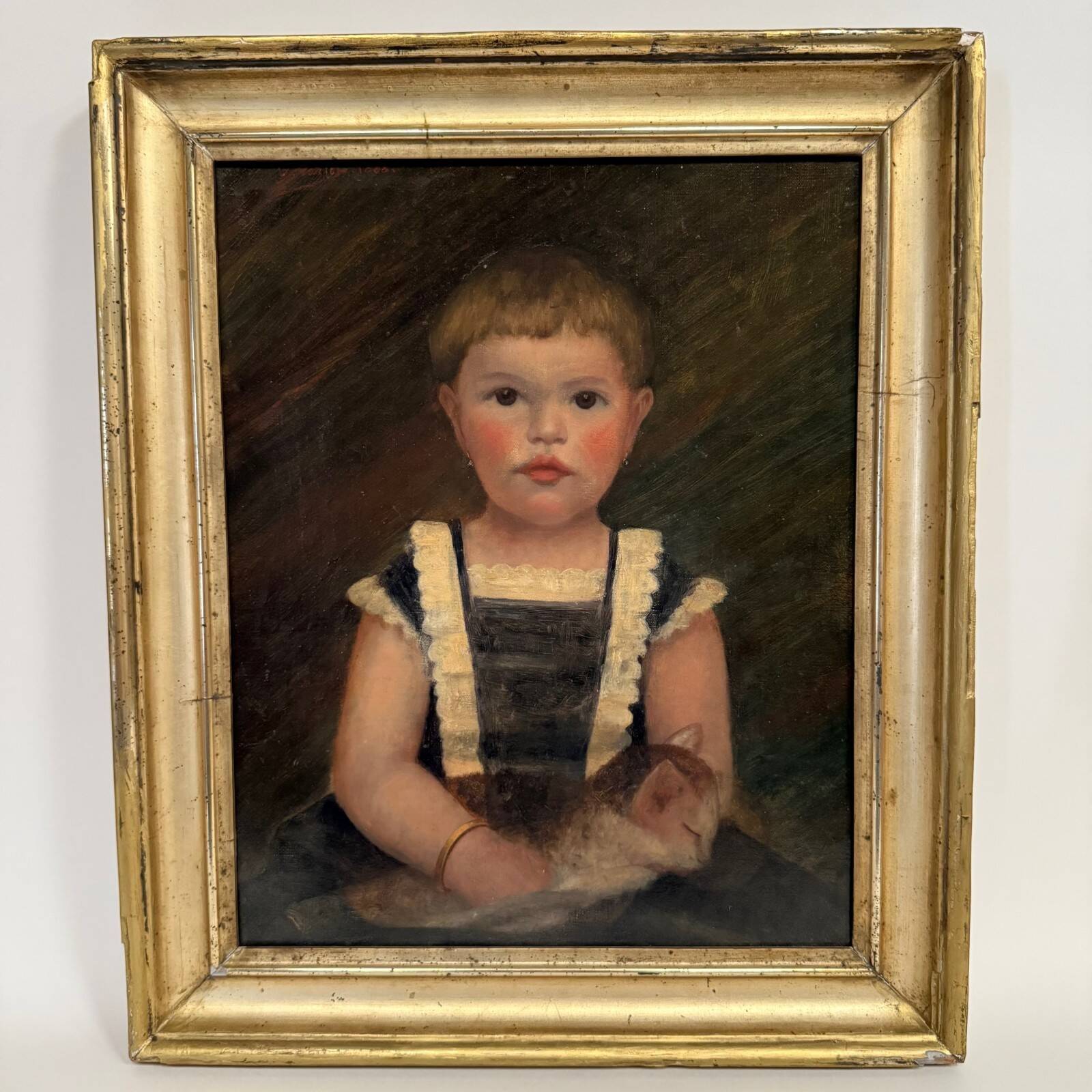 Oil on canvas 19th century young child carrying his cat gilded frame
