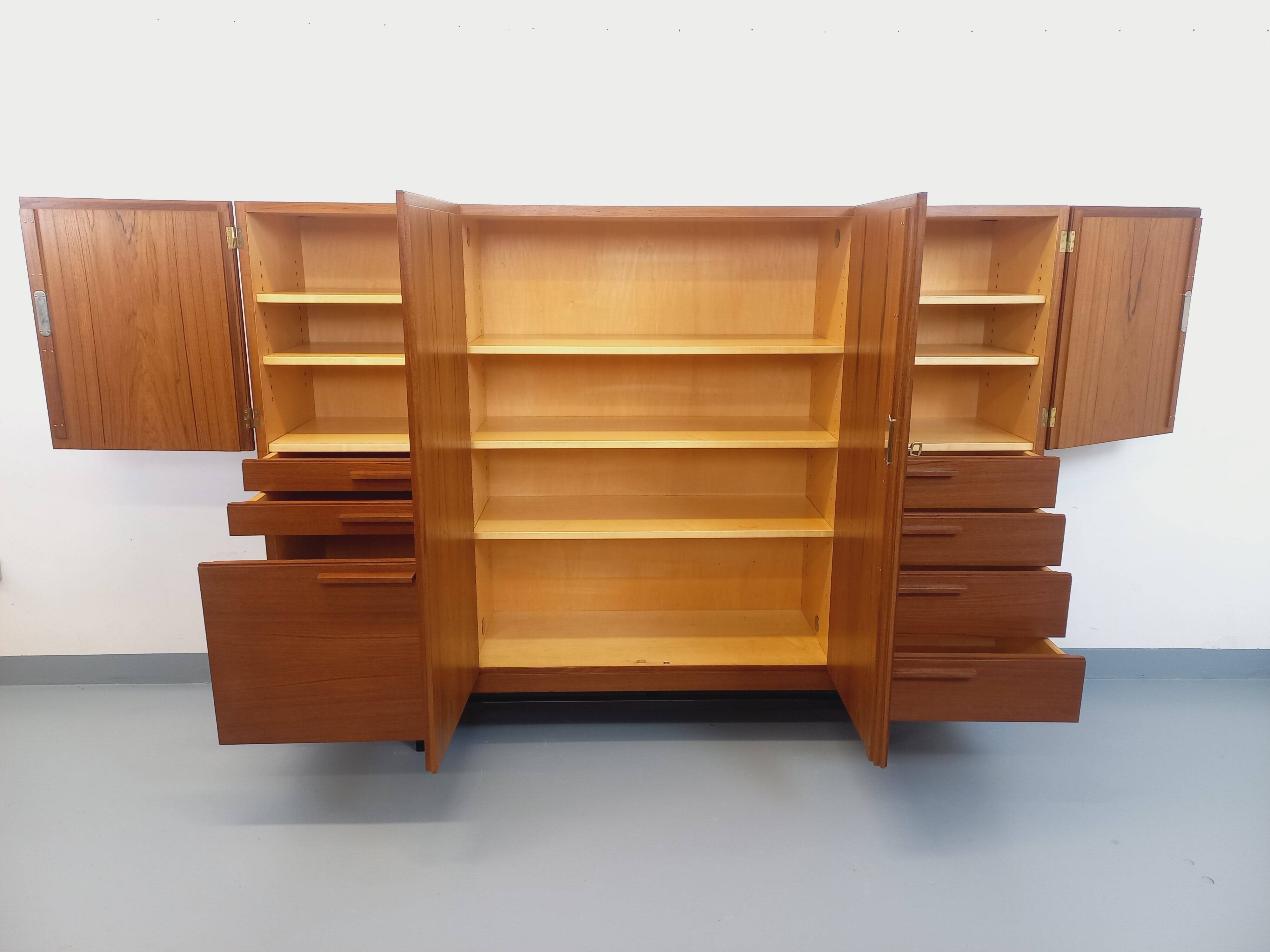 High Scandinavian modernist vintage sideboard in teak and black metal.