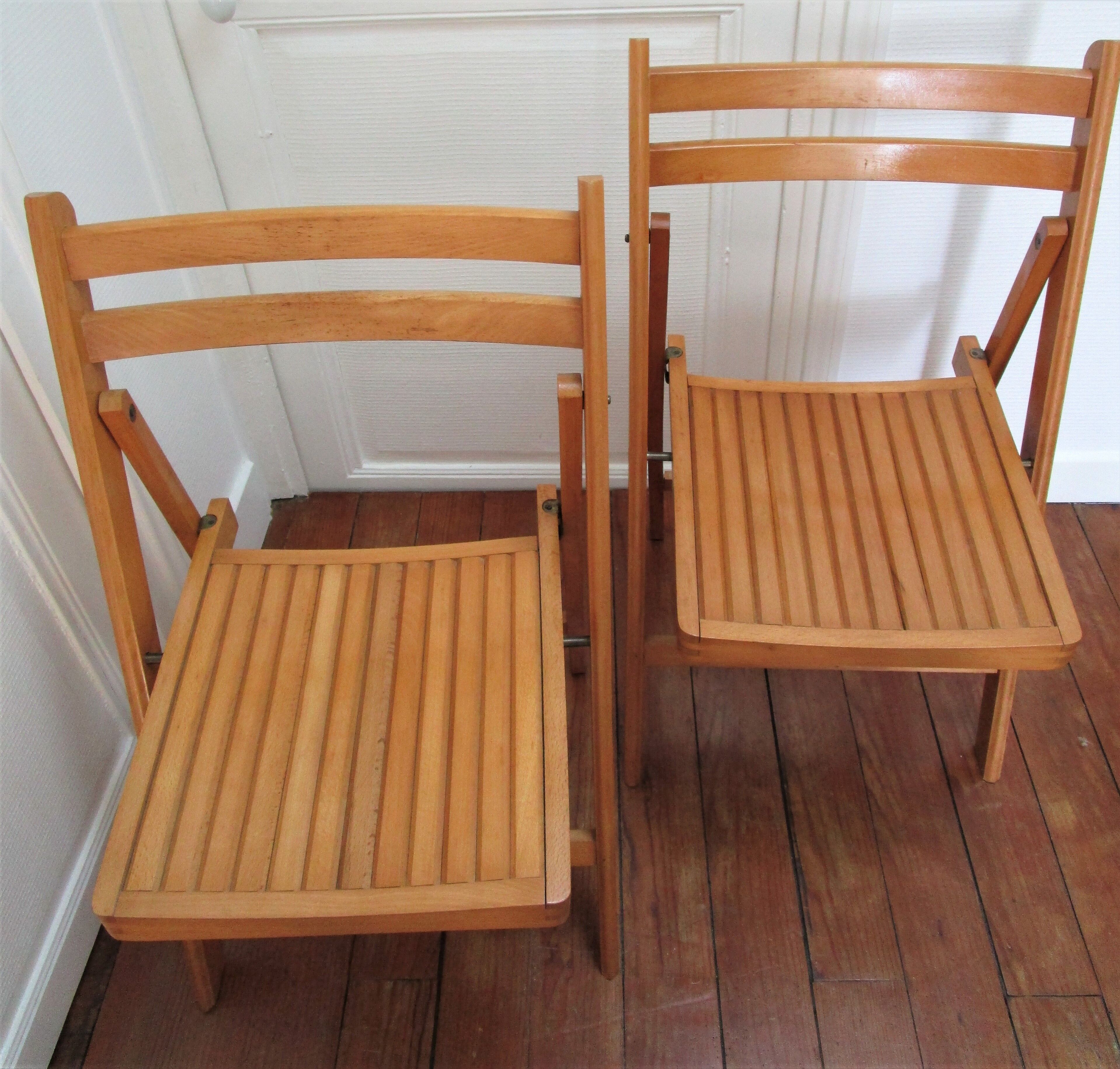 Pair of folding chairs with vintage solid wood slats