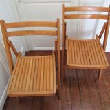 Pair of folding chairs with vintage solid wood slats