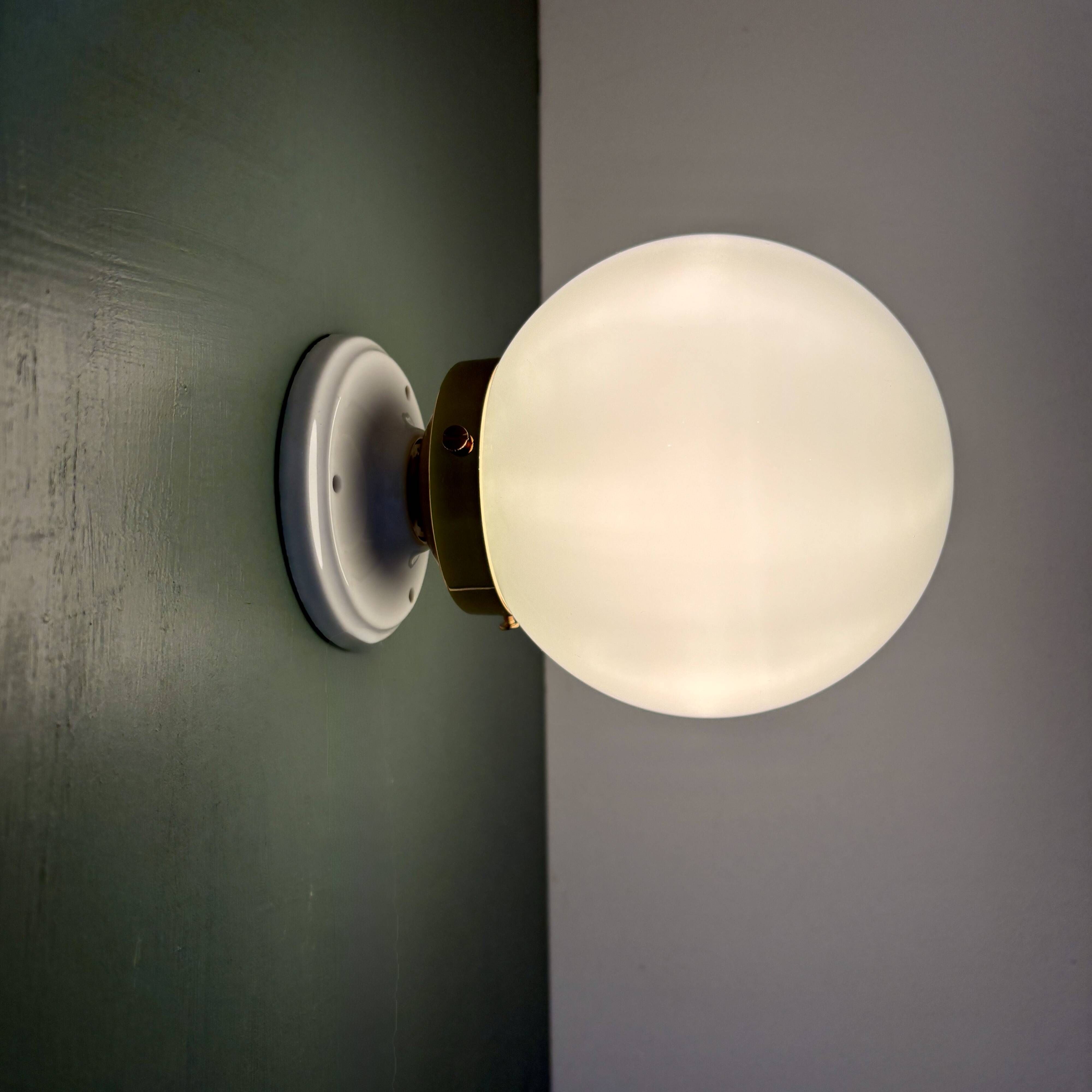Vintage globe wall or ceiling light in white opaline.
