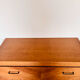 Commode en marqueterie de bois et pieds compas